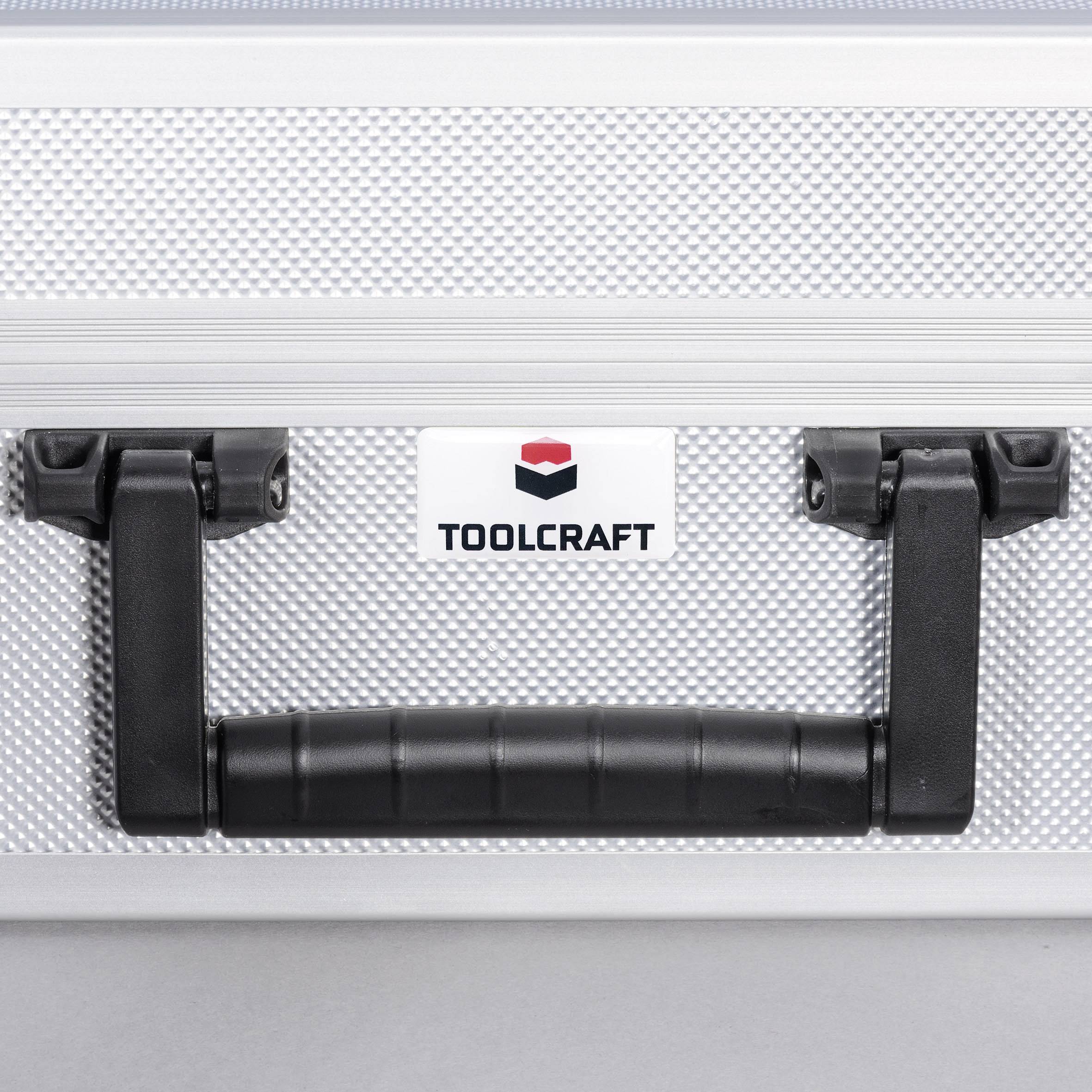 Stříbrný kufřík na nářadí s logem 'TOOLCRAFT' a černou rukojetí na šedém pozadí.