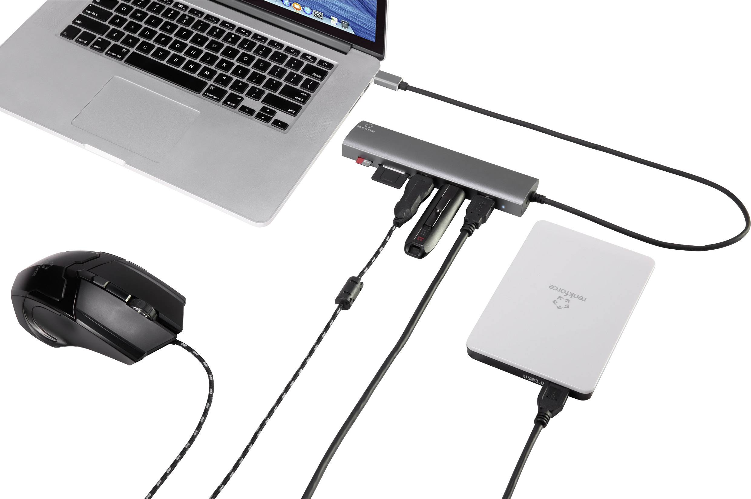Laptop je připojen k USB rozbočovači, ke které jsou připojeny myš, externí úložiště a USB flash disky.