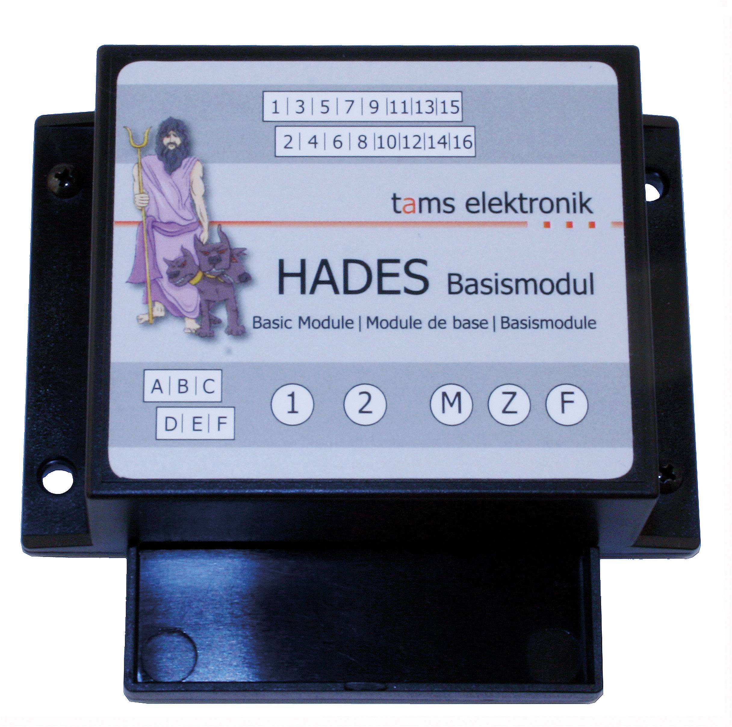 Elektronický základní modul s popisem 'HADES základní modul' a zobrazenou figurou s trojzubcem.