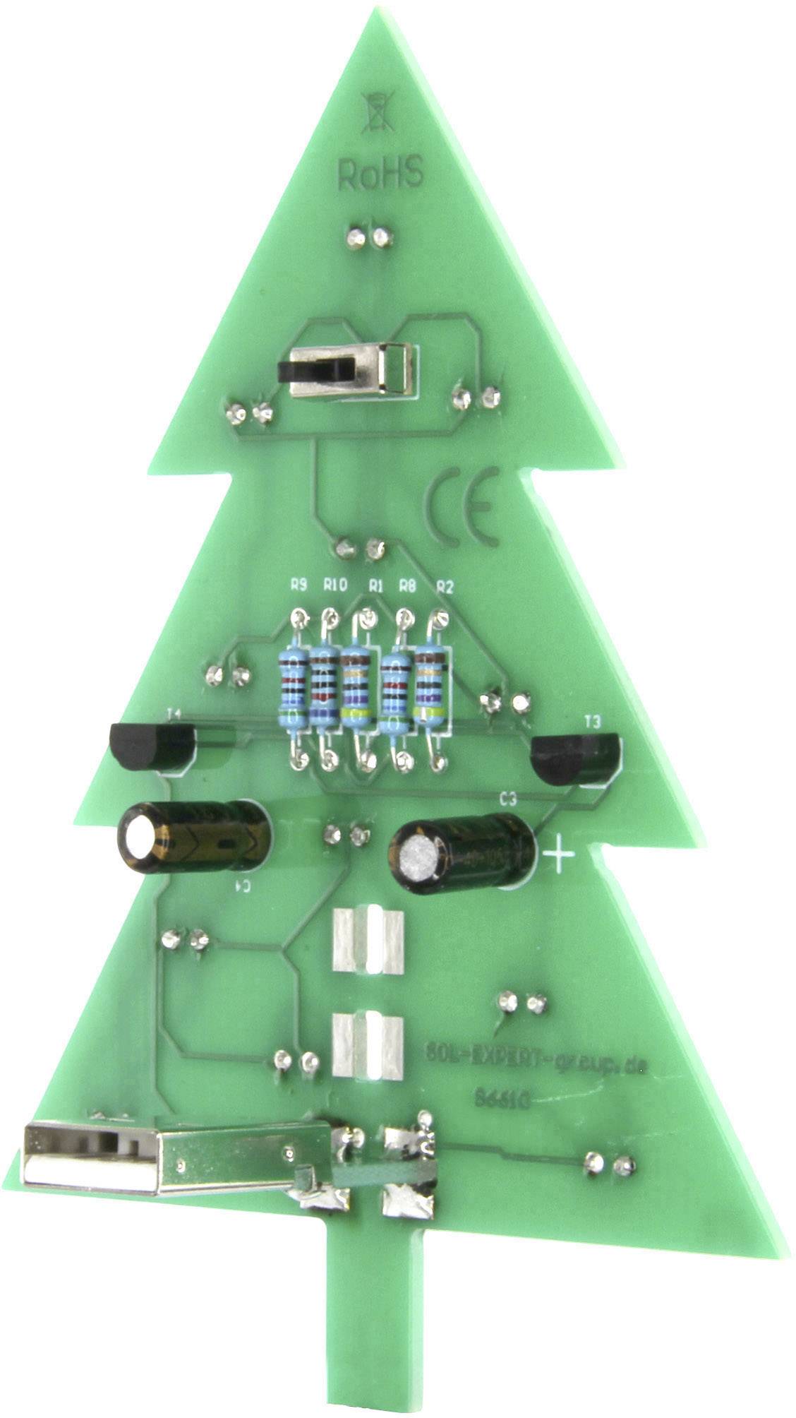 Deska plošných spojů ve tvaru vánočního stromku s komponenty jako jsou rezistory a kondenzátory; dekorativní elektronika.
