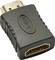 Černý HDMI adaptér s viditelnými konektory.