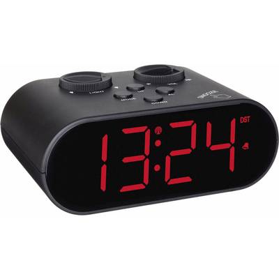 Černý digitální budík s červenými LED číslicemi ukazuje čas '13:24'. Nahoře jsou dva otočné knoflíky pro nastavení.