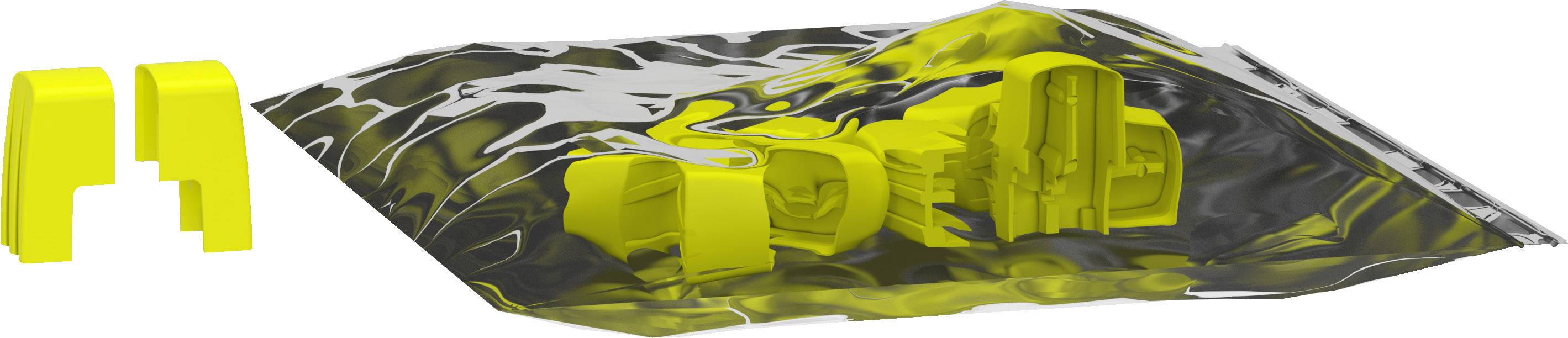 Žluté plastové formy leží na lesklé stříbrné plastové fólii.