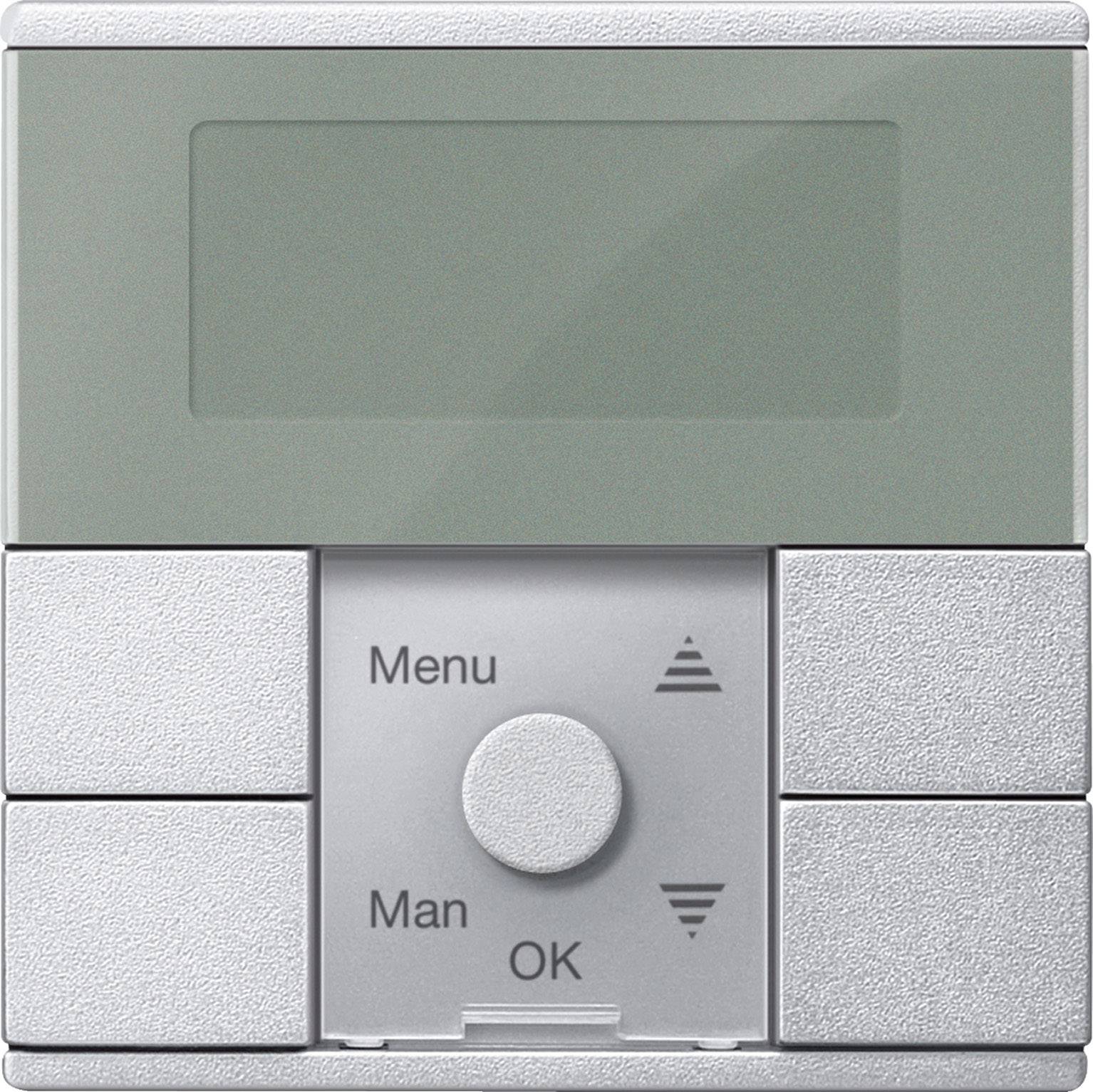 Elektronický ovládací panel s displejem, čtyřmi tlačítky a otočným kolečkem. Tlačítka: 'Menu', 'Man', 'OK'. Navigační šipková tlačítka.