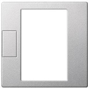 Plastový rámeček spínače s místem pro jeden vypínač vlevo a otvorem vpravo pro další prvek. Minimalistický design.