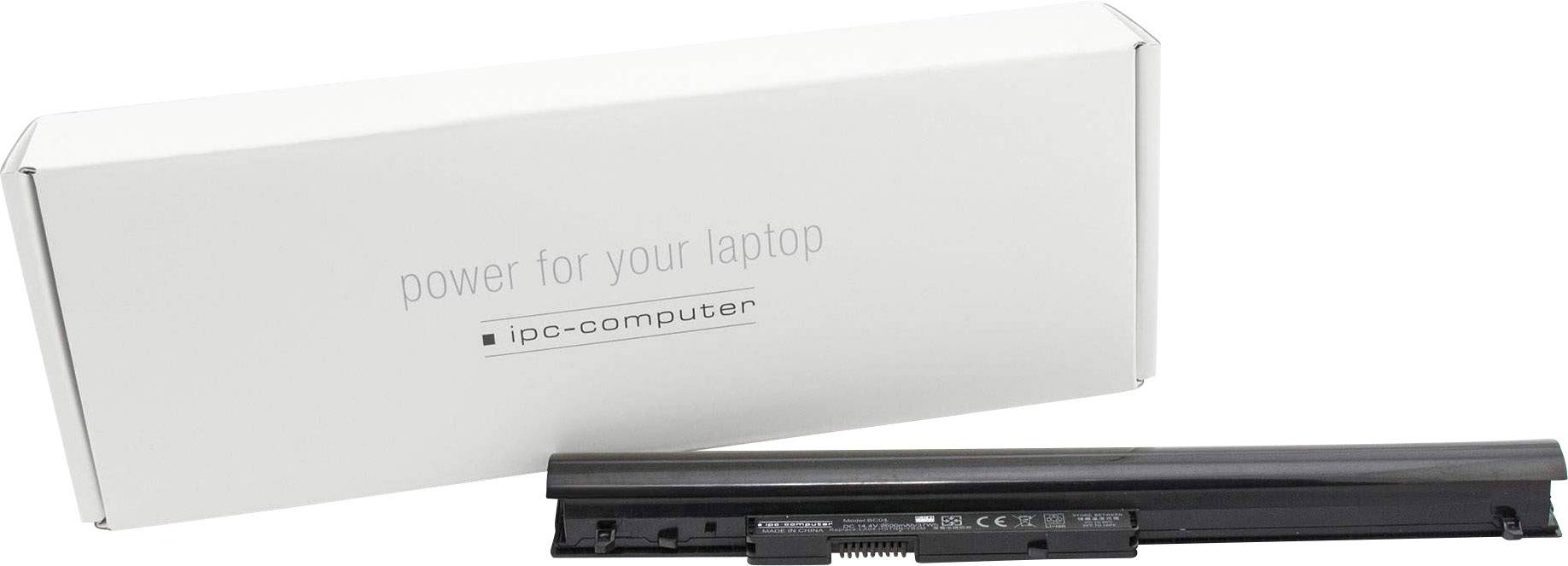 Baterie notebooku před bílým obalem s nápisem 'power for your laptop' a 'ipc-computer'.