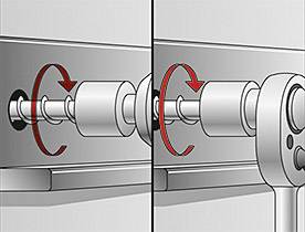 Ilustrace ukazuje, jak je hmoždinka pomocí klíče zašroubována do stěny. Šipky znázorňují směr otáčení.