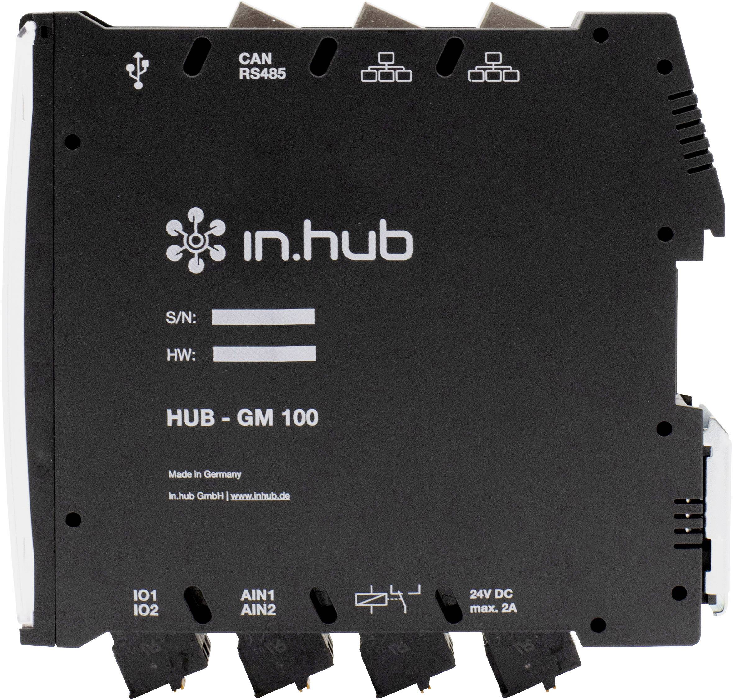 Černé zařízení s nápisem 'in.hub HUB-GM 100'. Jsou viditelné přípojky a sériová čísla. Výrobek je vyráběn v Německu.
