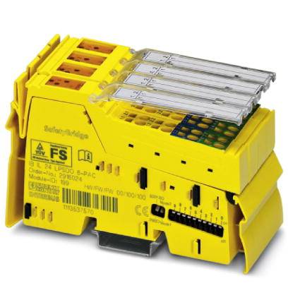 Žluté elektrické bezpečnostní moduly s několika konektory a symboly na povrchu, používané v průmyslových řídicích systémech.