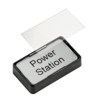 Malá obdélníková krabice s nápisem 'Power Station', částečně zakrytá průhledným víkem.