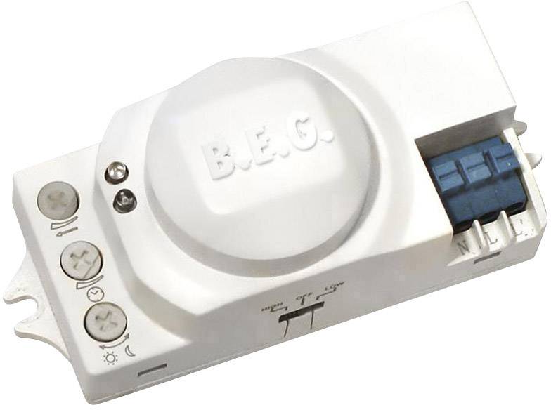Elektronický senzor v bílém pouzdře s nápisem 'B.E.G.', vybavený několika ovládacími prvky a přípojkami.