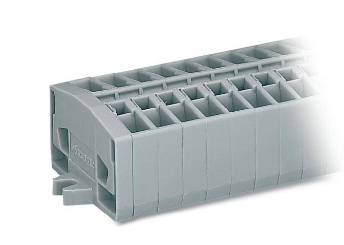 Šedý, obdélníkový plastový blok s několika vertikálními štěrbinami, pravděpodobně elektrický připojovací blok.