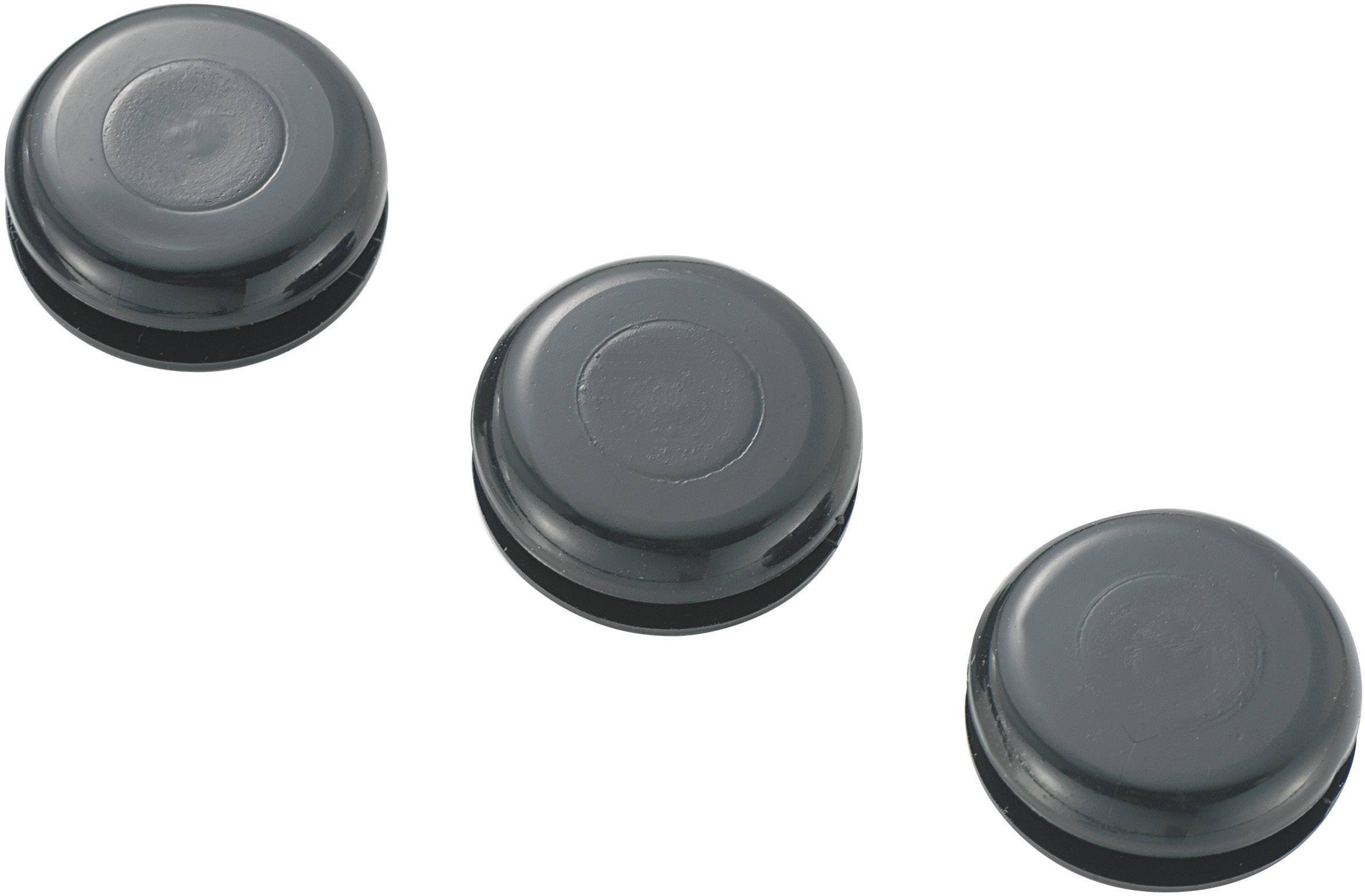 Tři černé magnetické svorky v mírně zakřiveném uspořádání.