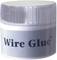 Kulaté sklo s bílým víčkem, označené nápisem 'Wire Glue', ukazuje elektrický vodivý prostředek pro spojování bez pájení.