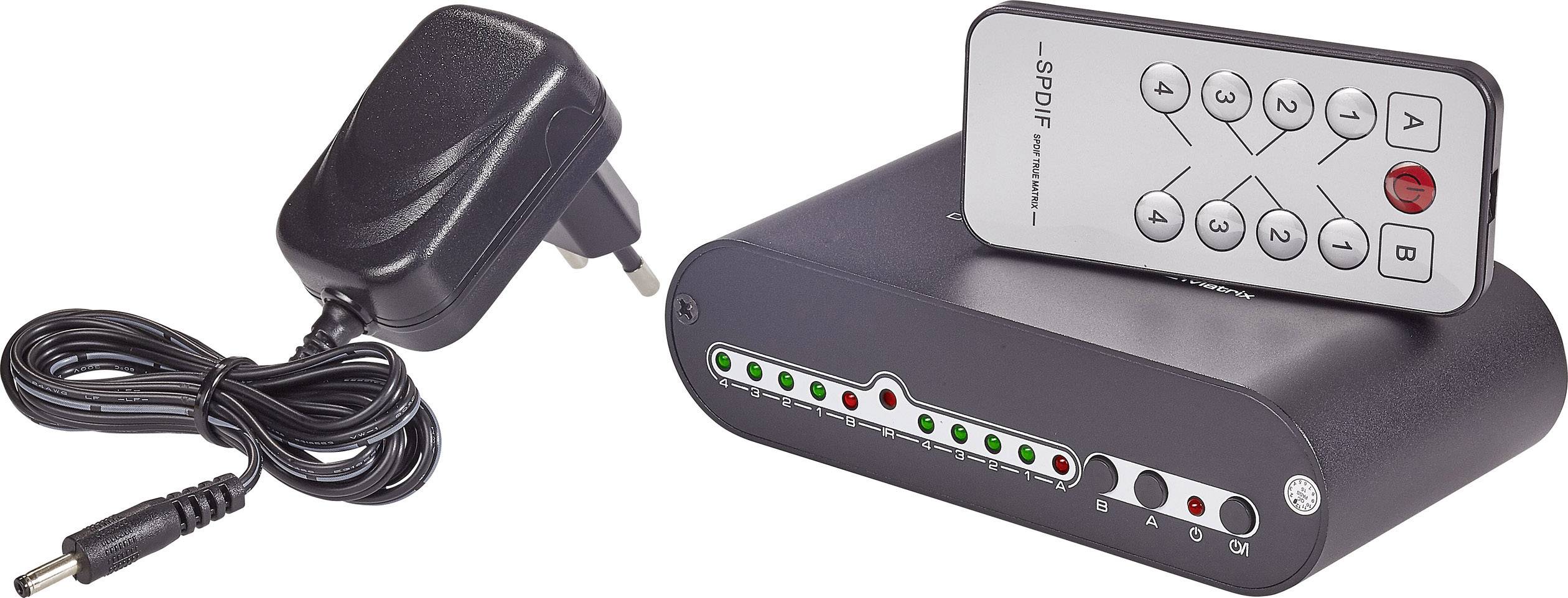 Černý audio dekodér s dálkovým ovládáním a napájecím adaptérem. Na přední straně svítí zelené a červené kontrolky.