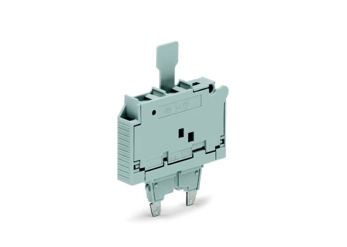 Šedý elektrický držák pojistek s plochými konektory dole a páčkou nahoře.