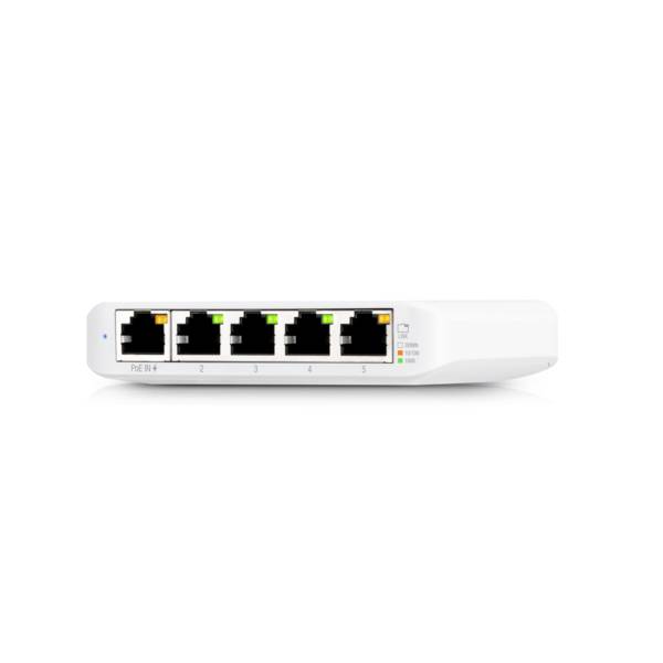 Bílý síťový switch s pěti ethernetovými porty, očíslovanými od 1 do 5, a LED diodami pro indikaci stavu.