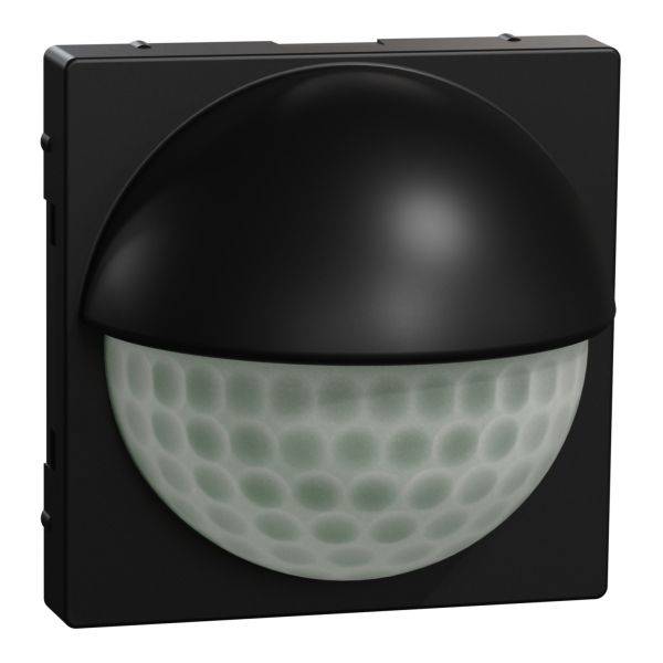 Černý pohybový senzor s polokulovou optikou, vhodný pro instalaci do elektroinstalačních krabic.