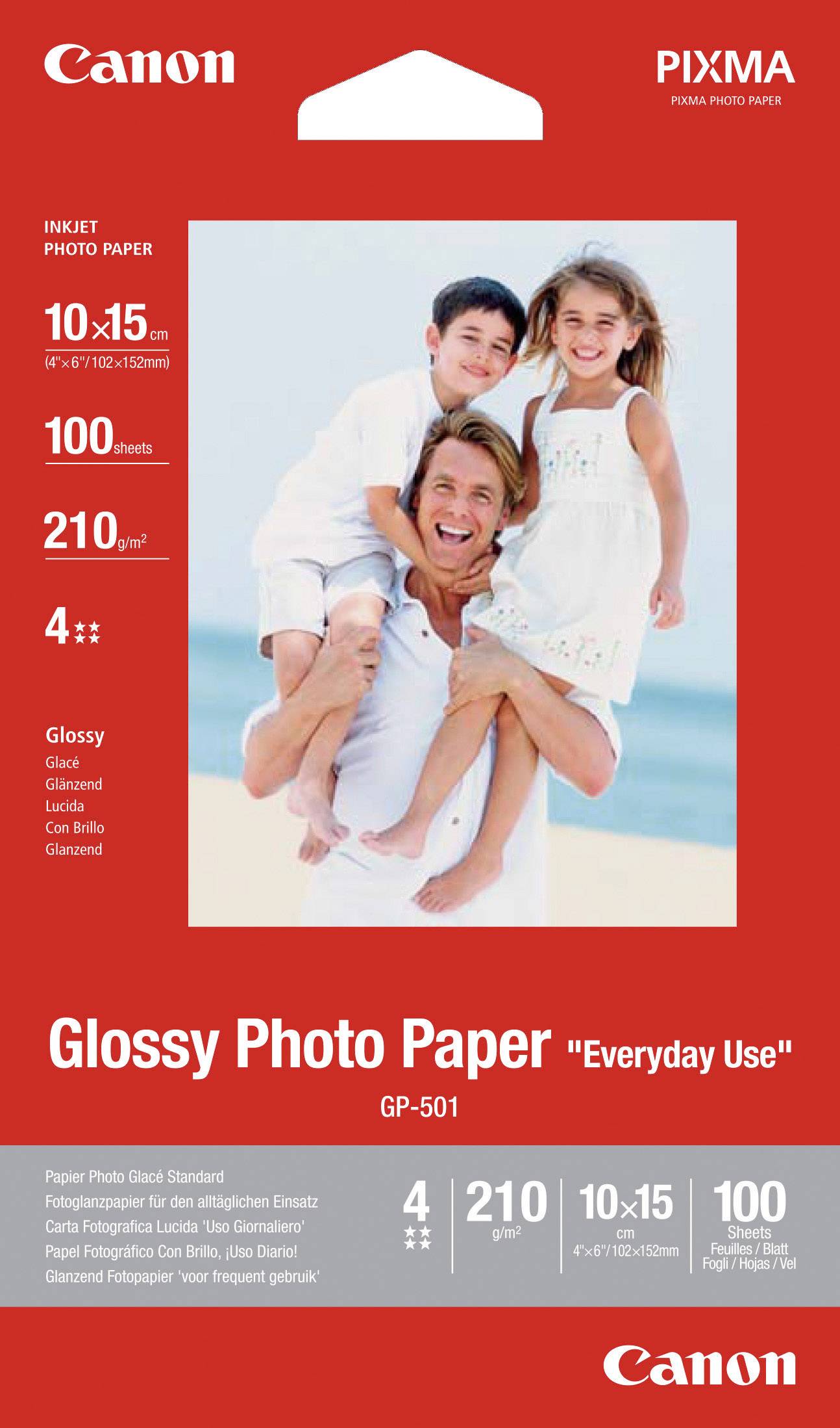 Balení pro 'Canon Glossy Photo Paper GP-501', zobrazuje otce s dvěma dětmi na pláži. 10x15 cm, 100 listů, vhodné pro každodenní použití.