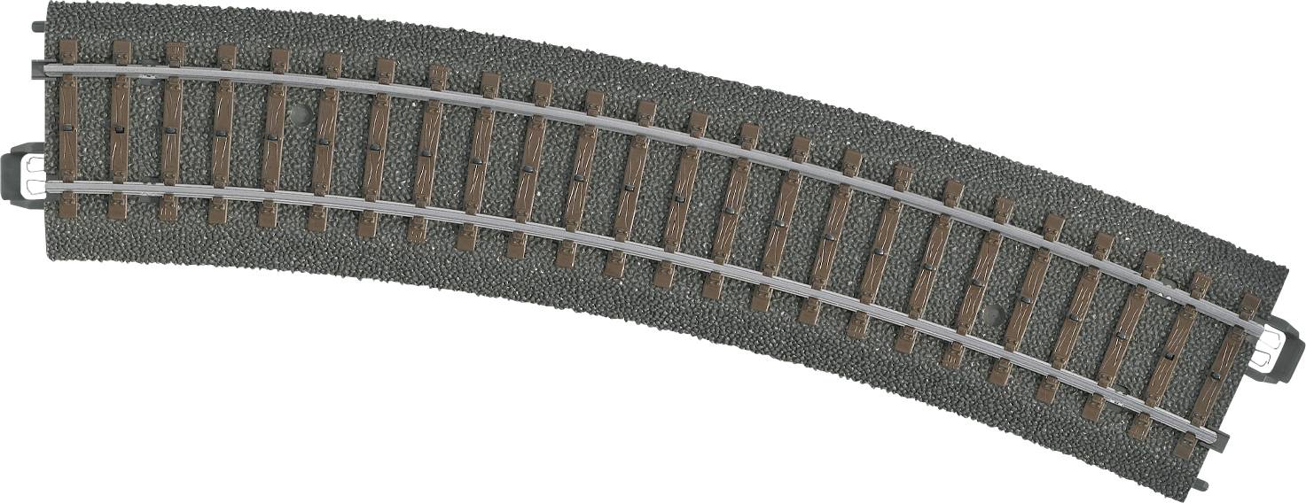 Et buet modelbanespor lavet af plast med træagtige sveller og metalskinner.