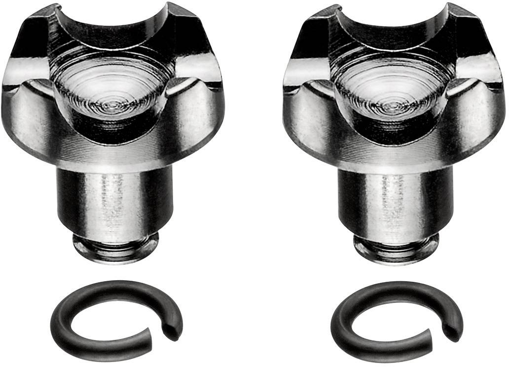 To metalliske dyvler med cirkulære riller og tilhørende sorte clips, på hvid baggrund.