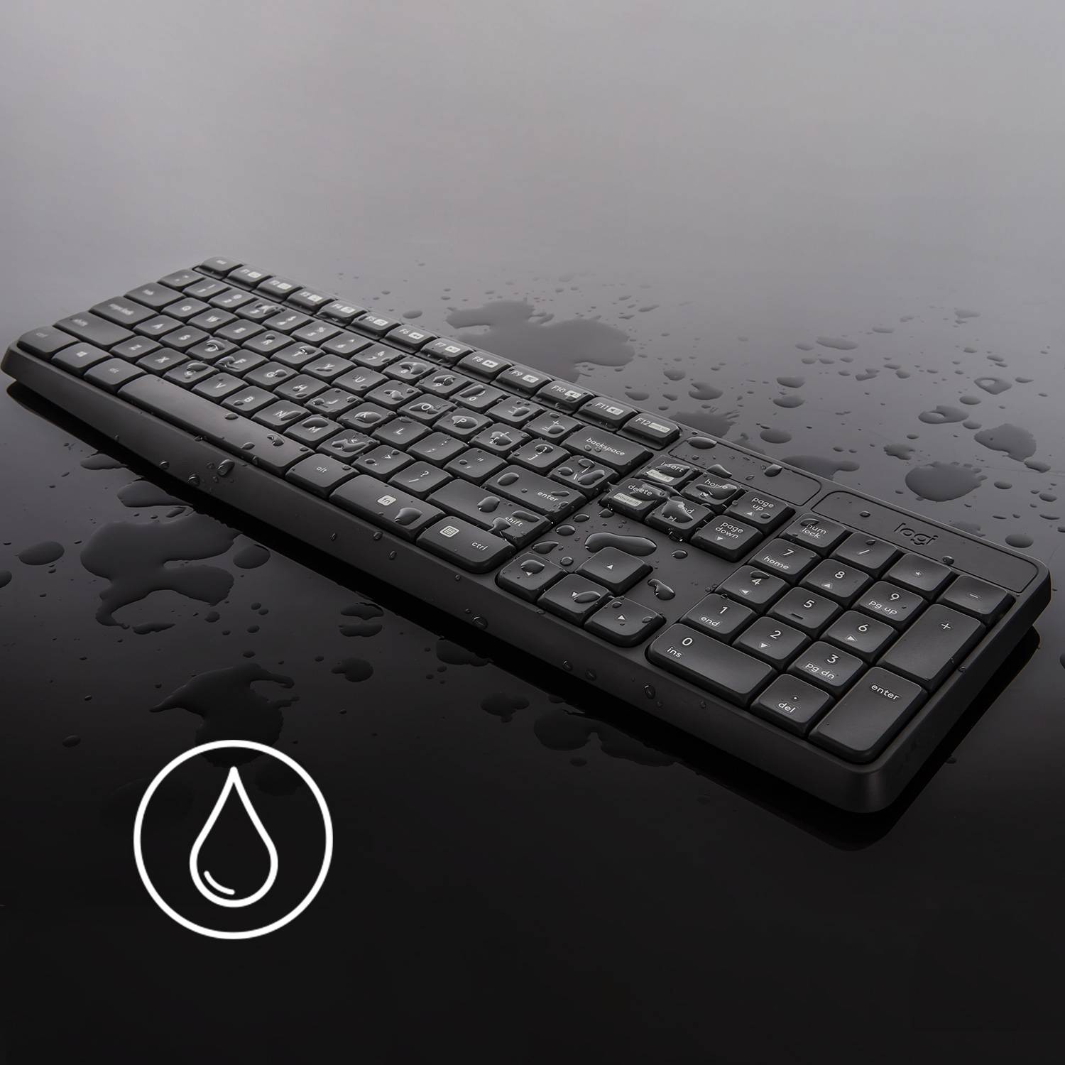 Et sort tastatur med vanddråber på sig og et symbol for vandafvisningsikonet, der antyder vandtæthed.