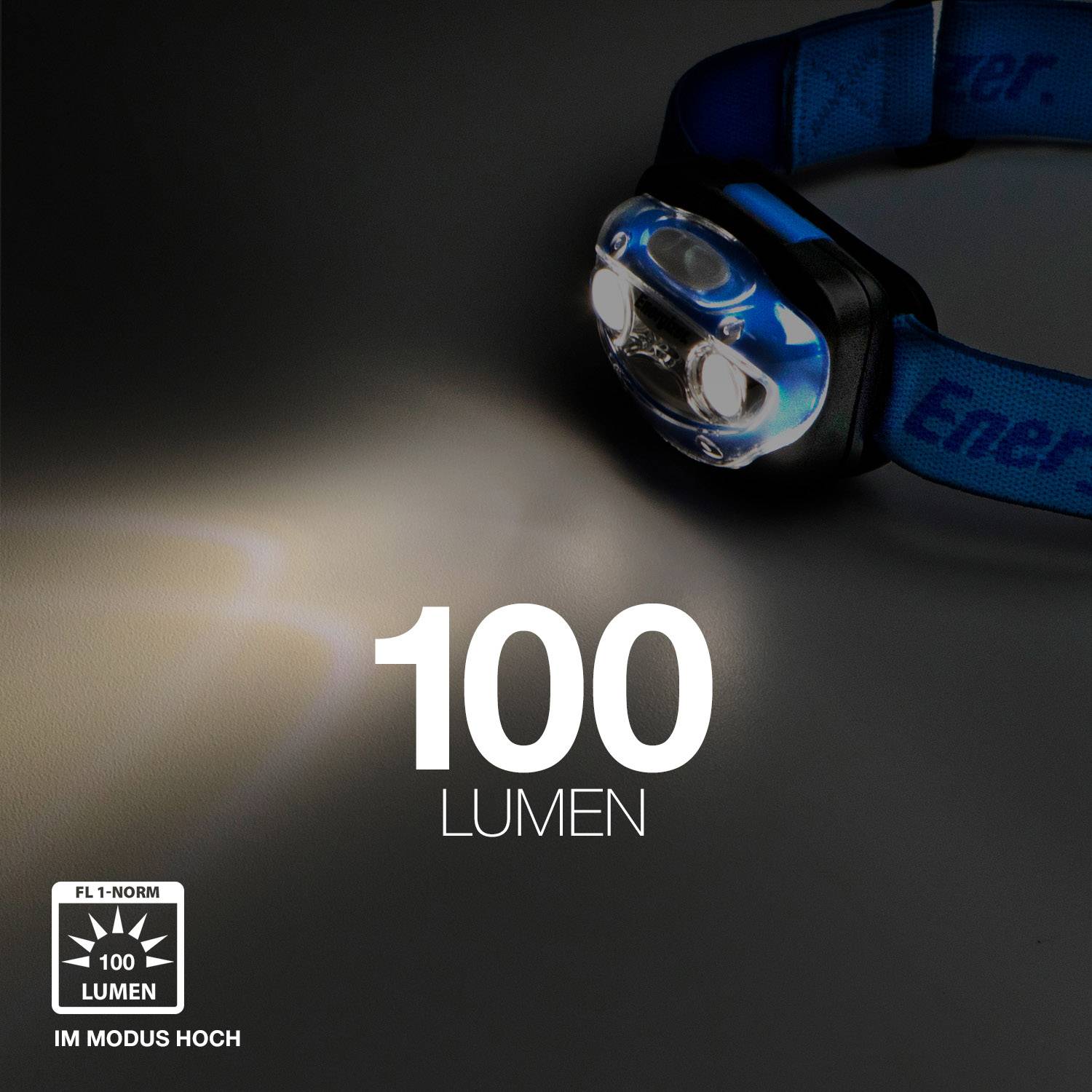 Et pandelys lyser med 100 lumen i et mørkt rum. Påskrift '100 lumen', logo nederst til venstre for høj lysstyrke.