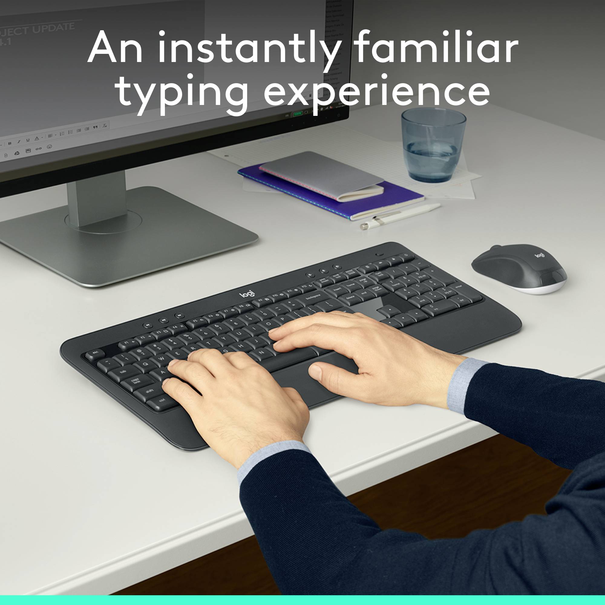 En person taster på et sort tastatur foran en computerskærm. Øverst står teksten 'Øjeblikkelig fortrolig skriveoplevelse'.