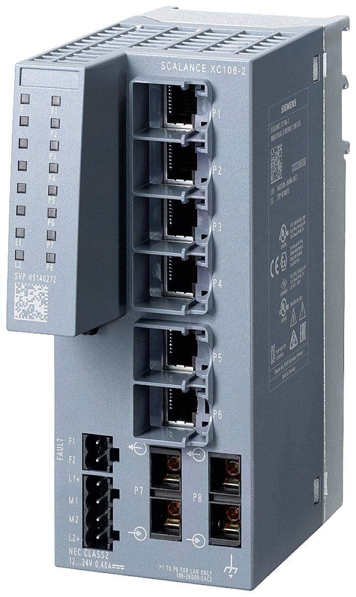 En grå netværksswitch med otte Ethernet-porte, hvoraf fire er placeret øverst og fire nederst. Til venstre er der LED-indikatorer for status.