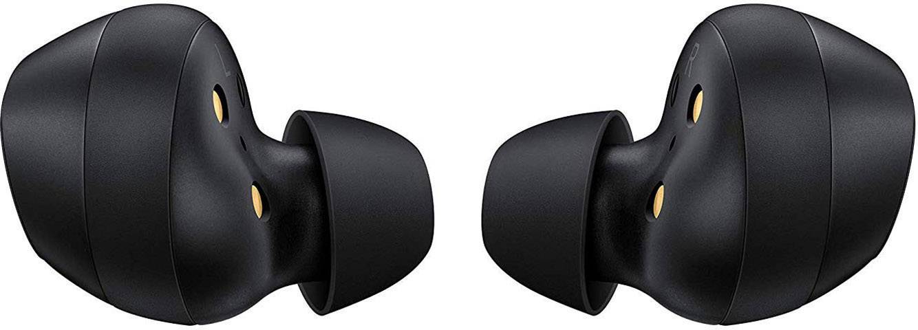 Trådløse sorte øretelefoner set fra siden. Øretelefonerne har en ergonomisk form og små guldkontakter til opladning.