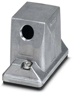En rektangulær, sølvfarvet metalblok med en rund åbning og en fastskruet base, sandsynligvis til tekniske formål.