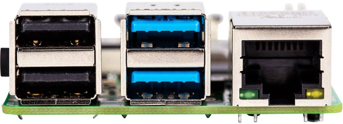 Nærbillede af et kredsløbskort med to USB-porte og en Ethernet-forbindelse, som bruges til elektroniske forbindelser.