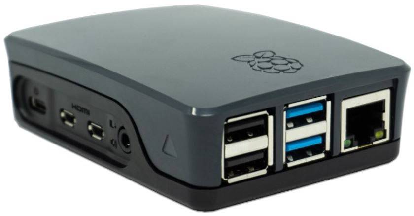 Et sort kabinet til en enkeltpladekomputer med flere USB- og netværkstilslutninger, ved siden af HDMI- og lydstik.