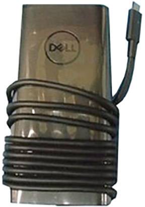 Et sort Dell-oplader med et oprullet kabel ligger fladt på en overflade.