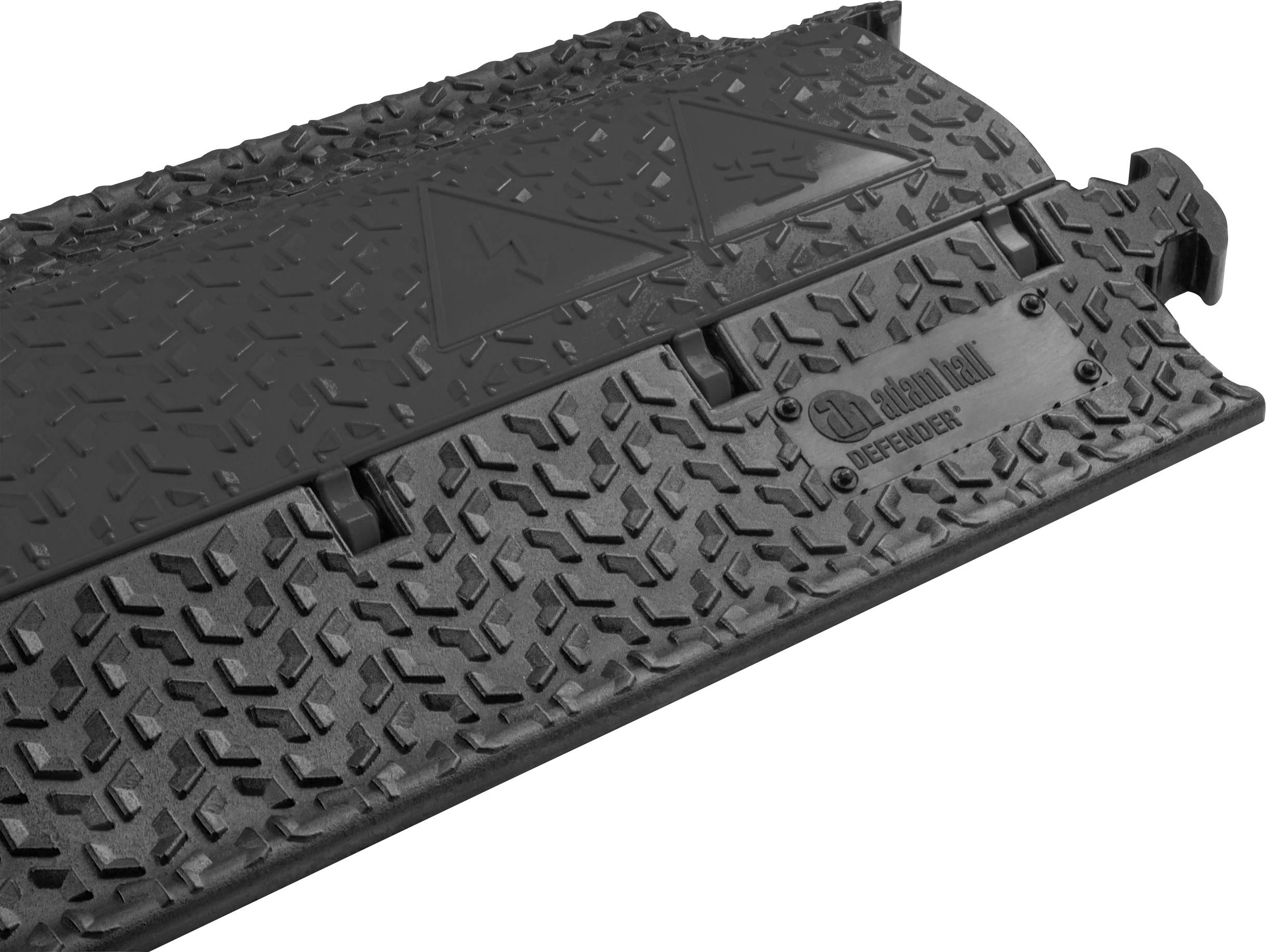 En skridsikker, sort gummiafdækningsplade med 'defender' påskrift, egnet til tunge køretøjer til overfladeafsikring.