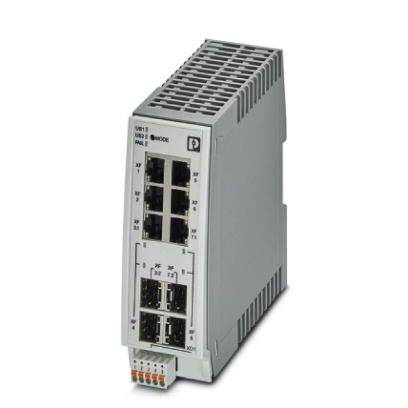 En grå elektrisk switchenhed med flere Ethernet- og fiberoptiske tilslutninger, sandsynligvis brugt til netværksforbindelse.