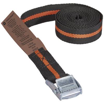 En sort spændsele med orange stribe, oprullet, med metalspærre og mærkat med tekst til sikker fastgørelse.
