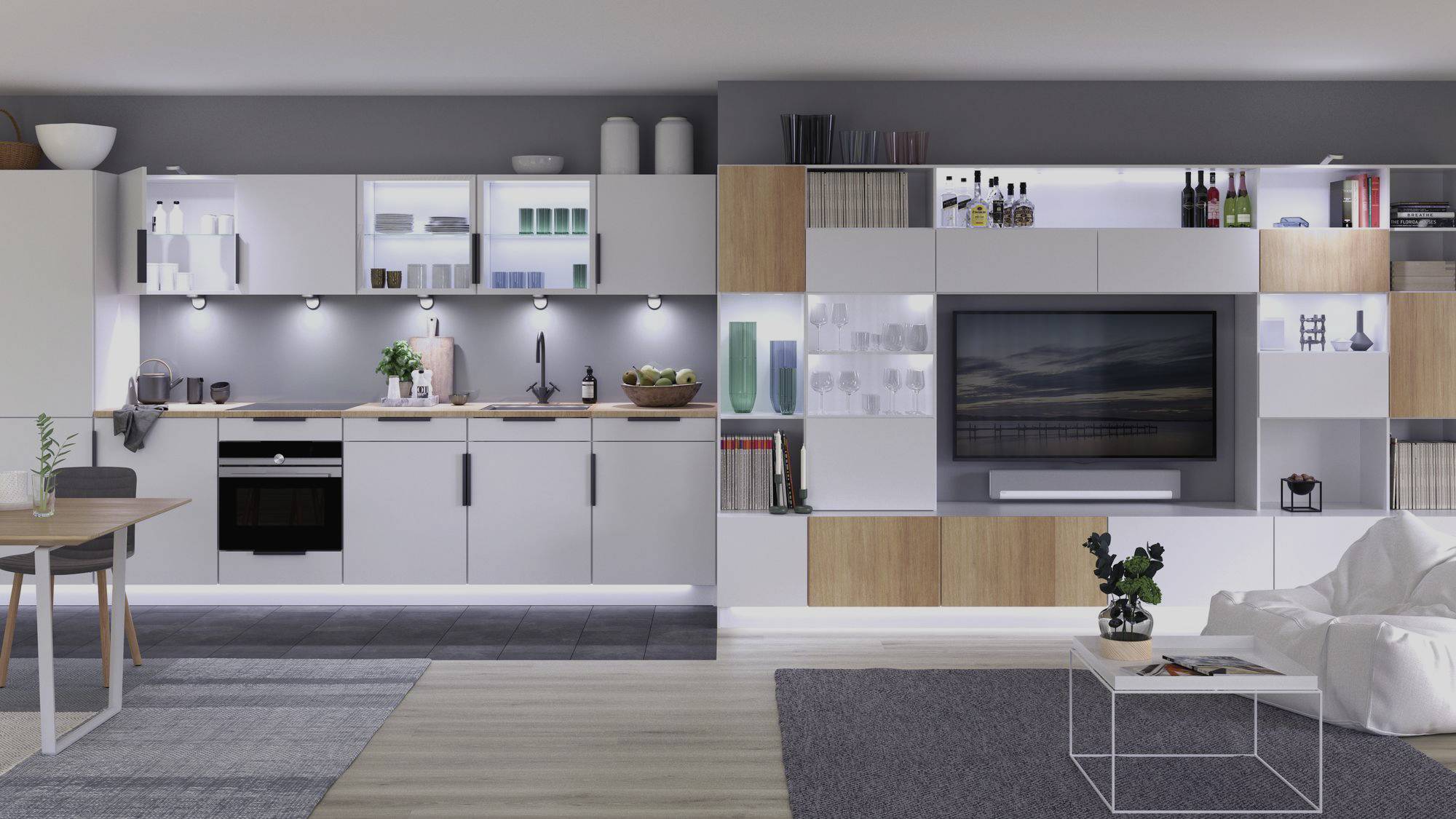 Moderne køkken og stue med åben planløsning. Køkken til venstre med hvide skabe, stue til højre med grå og træfarvede accenter.