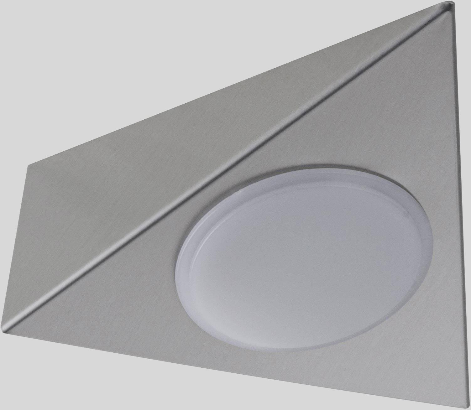 En trekantet, sølvfarvet LED-lampe med en rund, hvid lysdiffuser befinder sig på en grå overflade.