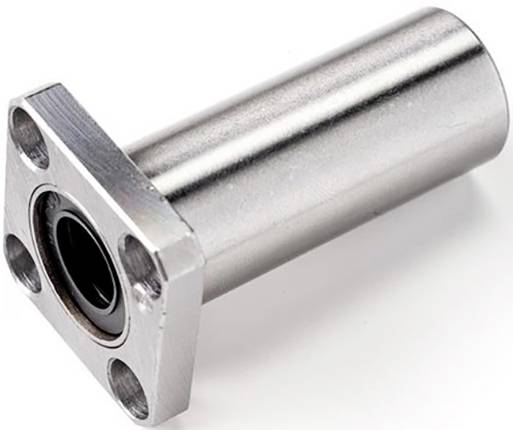 Cylindrisk metalkomponent med flange og fire huller, sandsynligvis et lejehus, afbildet på hvid baggrund.