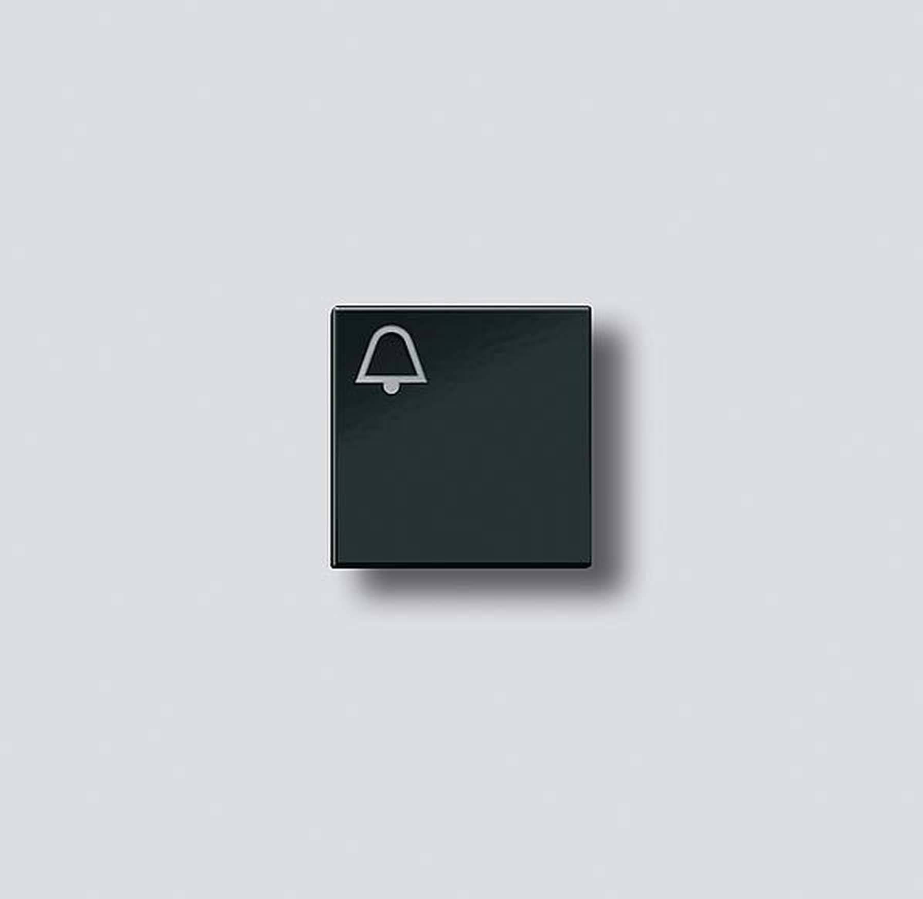 Sort firkant med klokke-symbol på grå baggrund.