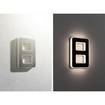 Væglampe med rektangulært design, dag og nat. Til venstre reflekterer sollyset, til højre spreder lampen et diffust lys i mørket.