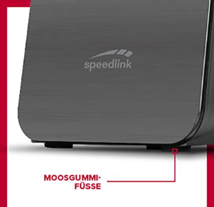 Sort, riflet enhed med 'speedlink' logo. Nederst står der 'Moosgummifødder' ved siden af en rød pil, der peger på dem.