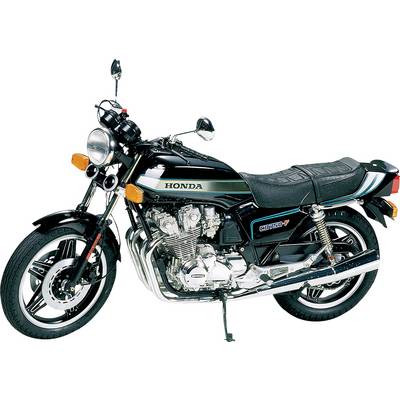 Sort Honda-motorcykel, set fra siden. Kromdetaljer og polstret sæde synlige. En klassiker inden for motorcykelteknologi.