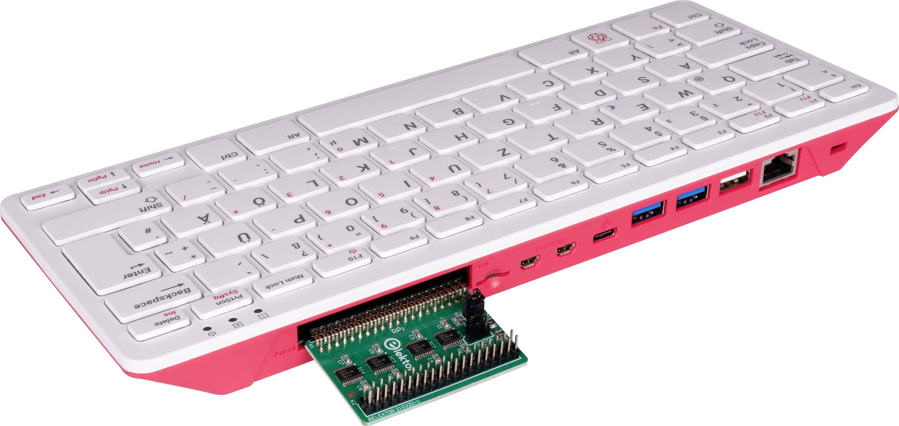 En kompakt computer i tastaturformat med et udskifteligt modul i bunden, som viser forskellige tilslutninger.