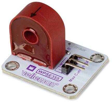 Elektronisk strømsensor med rød ferritekerne og Velleman-logo. Udviklet til måling og overvågning af elektriske strømme.