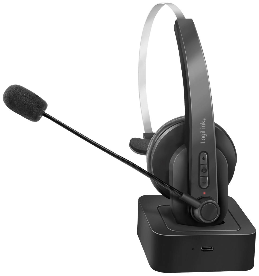 Et trådløst headset i en ladedok. Headsettet har et justerbart mikrofon og ørepuder for behagelig pasform.