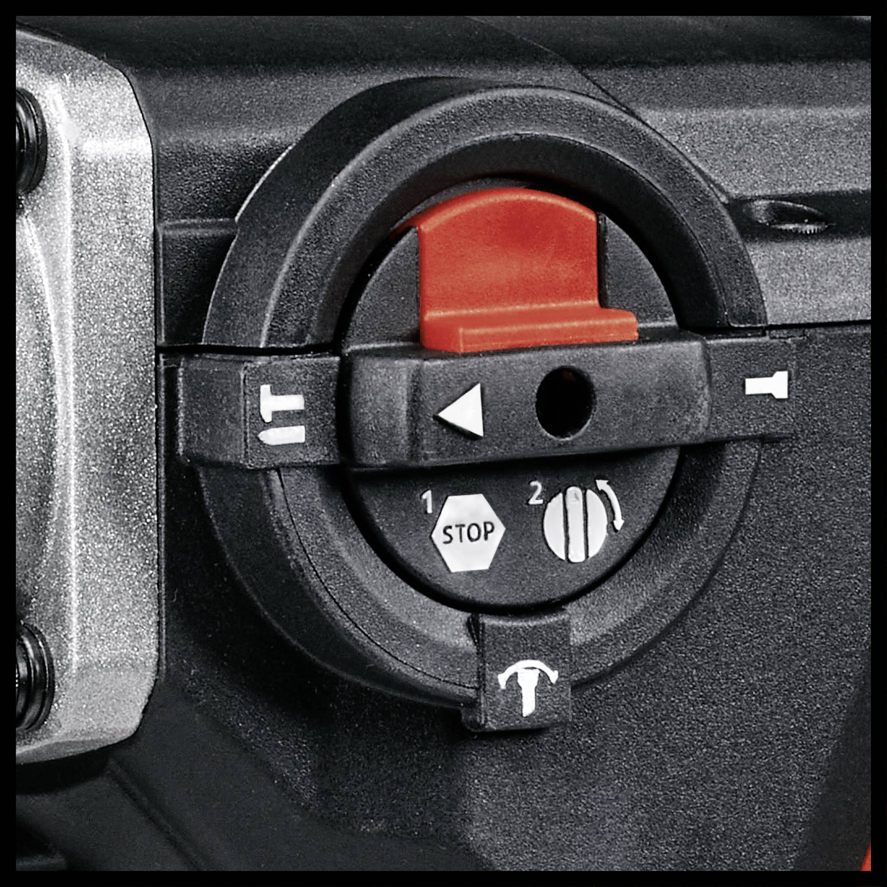 Kontakt på en enhed med tre symboler: 'Stop' øverst, '1' til venstre for lav hastighed, '2' til højre for høj hastighed.