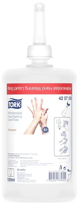 Gennemsigtig dispenser med 'TORK Antibakteriel Håndsæbe' etiket. Viser hænder med trinvise påføringsanvisninger. 1000 ml indhold.