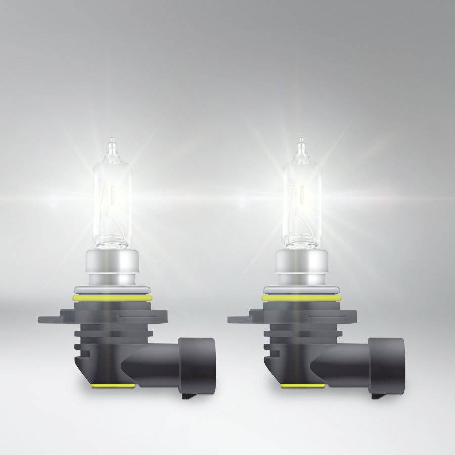 To herkalende halogenlamper på en grå baggrund. Lamperne er placeret lodret ved siden af hinanden og udsender et klart, intenst lys.
